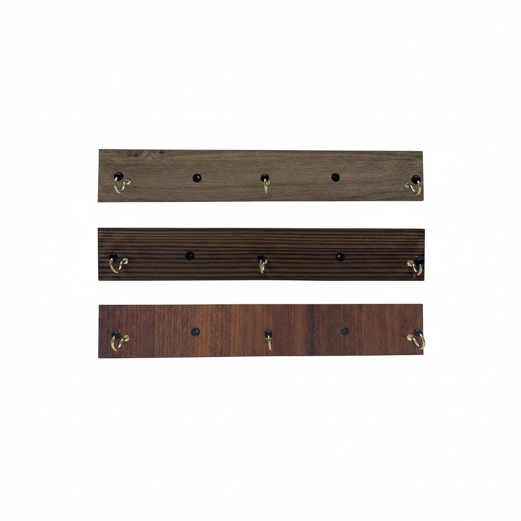 Distribuidora La Frontera wooden wall hook rack with 3 brass hooks, available in light brown, dark brown, and walnut finishes.